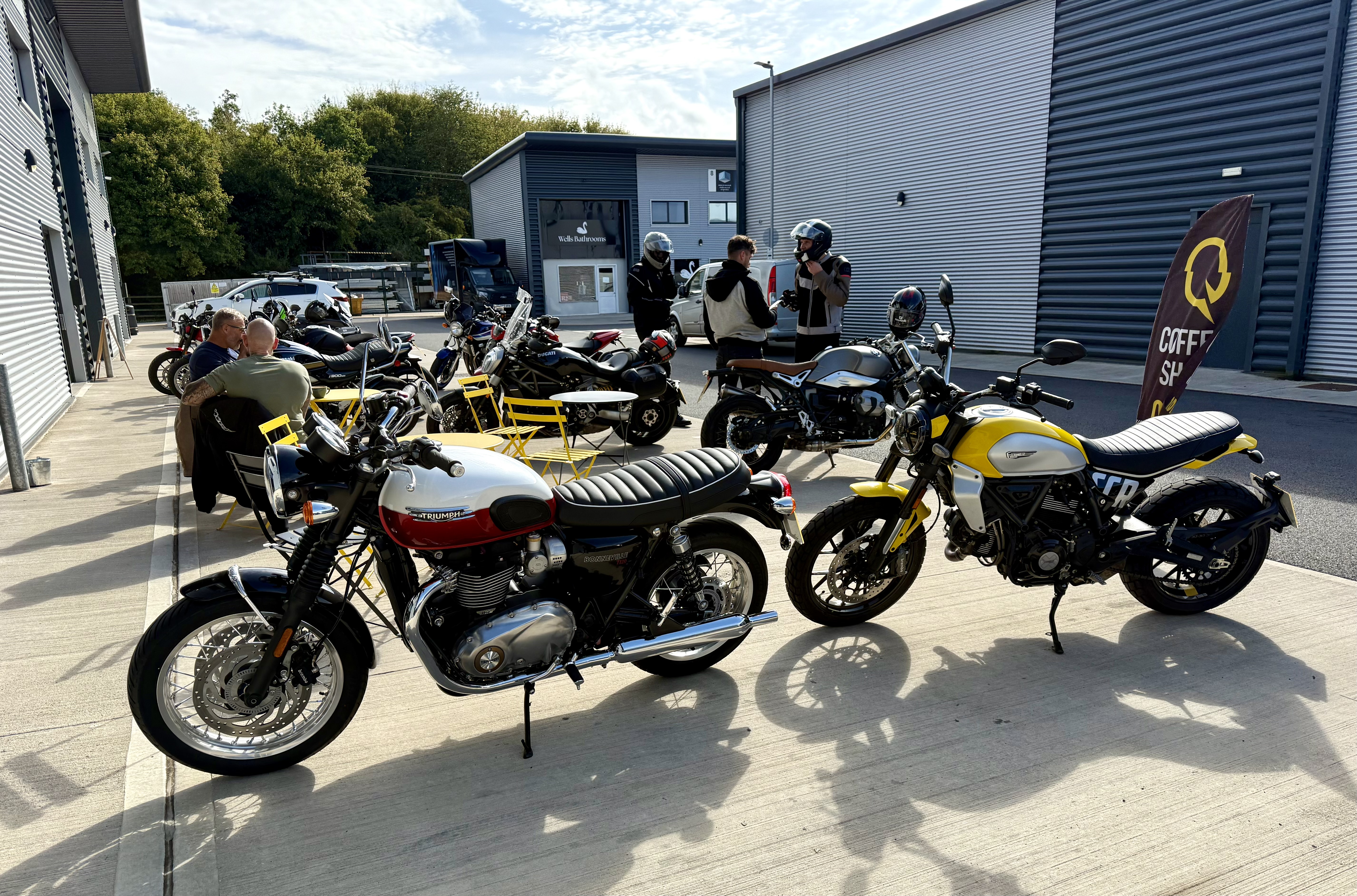 Andy's Triumph Bonneville T120 and Janet's Ducati Scrambler Icon outside Quickshifter Coffee in Wells, Somerset